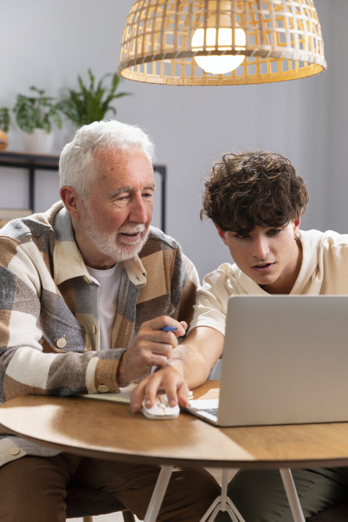 medium shot senior man looking laptop